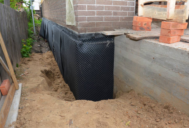 Happy homeowners after waterproofing job in Holmdel